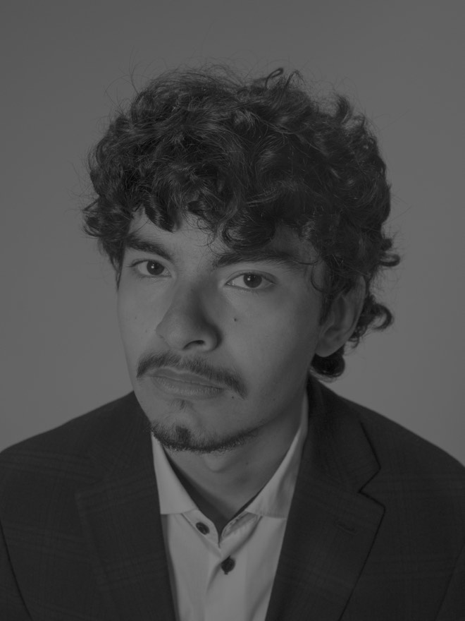 Black and white portrait of Tony with a neutral expression