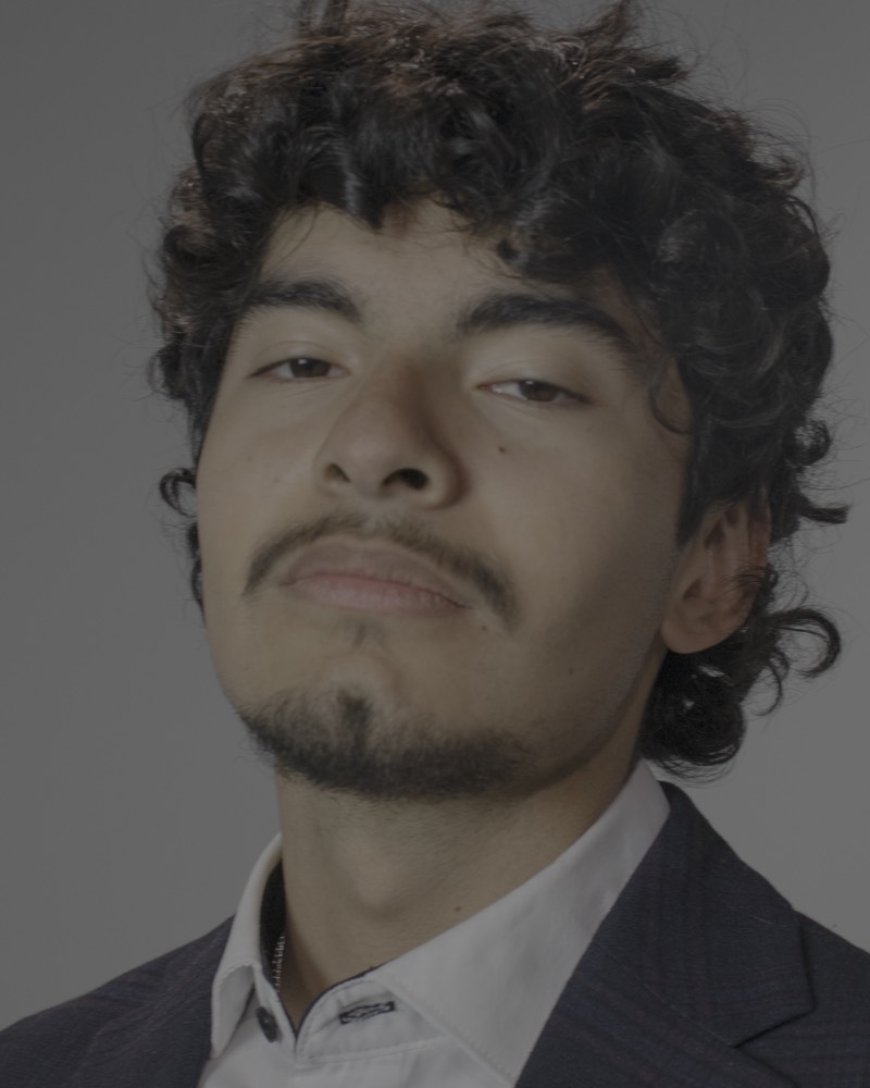 Close portrait of Tony Serrato looking directly at the camera